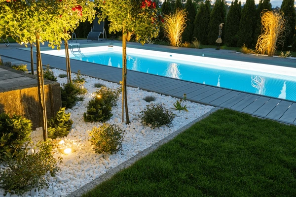 Outdoor room with patio, wall, planting, and space for gathering